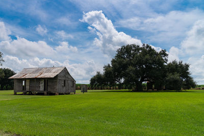 House on field against sky