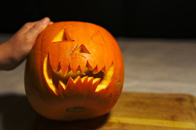 Close-up of illuminated pumpkin at home