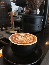 Close-up of frothy drink on table in cafe