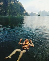 Portrait of man swimming in lake