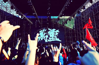 People enjoying music concert at night