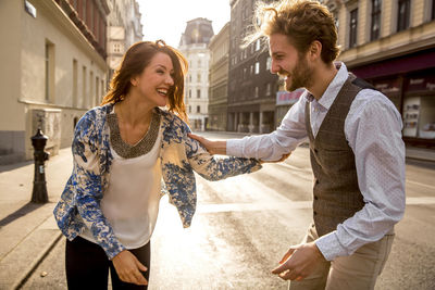 Young couple smiling in city