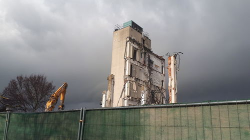 Low angle view of abandoned building against sky