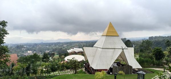 Panoramic view of temple building against cloudy sky