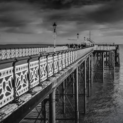 Pier over sea against sky