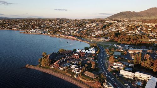 High angle view of townscape by sea