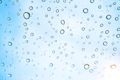 Full frame shot of wet glass during rainy season