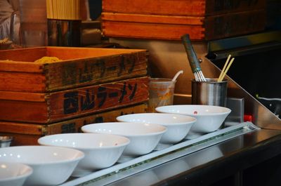 Empty bowls on table in market