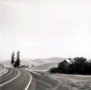 Empty road against clear sky