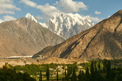 Scenic view of snowcapped mountains against sky