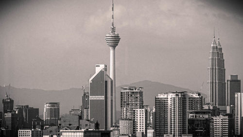 Skyscrapers in city against sky