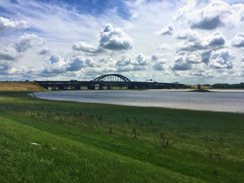 Bridge over river against sky