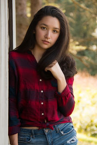 Portrait of teenage girl standing outdoors