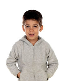 Portrait of boy standing against white background