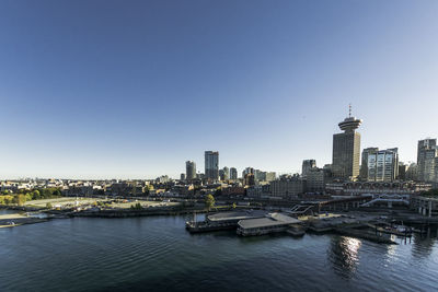 Modern buildings in city against clear sky