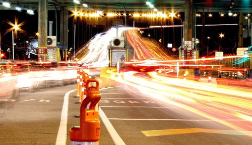 Traffic light trails on road at night