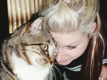 Close-up of beautiful blond with cat