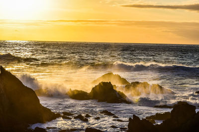 Scenic view of sea against sky during sunset