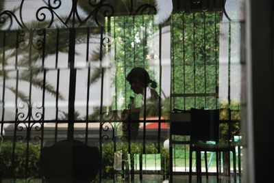 Metal grate on glass window of building