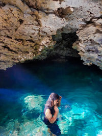 Woman swimming in sea