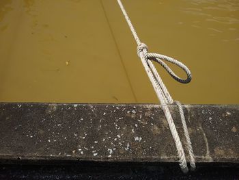 Close-up of rope tied on wall