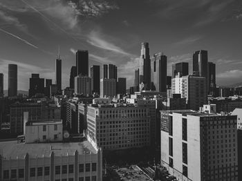 Modern buildings in city against sky