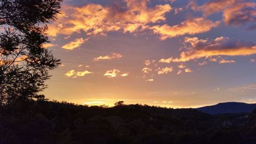 Scenic view of landscape against sky during sunset