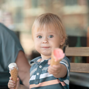 Portrait of cute girl holding ice cream cone