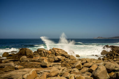 Scenic view of sea against clear sky