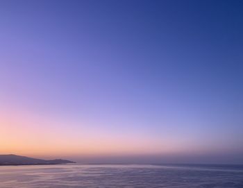 Scenic view of sea against clear sky during sunset