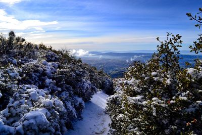 Scenic view of snow covered mountain against sky