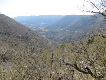 Scenic view of landscape and mountains against sky