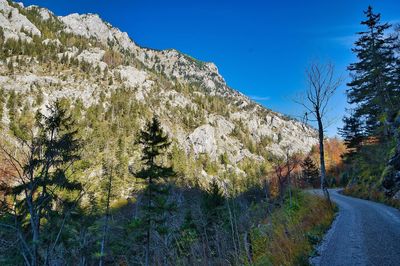 Scenic view of mountains against clear blue sky