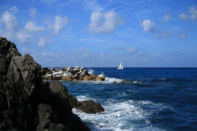 Sailboat sailing in sea