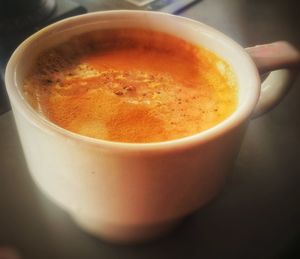 Close-up of cappuccino on table