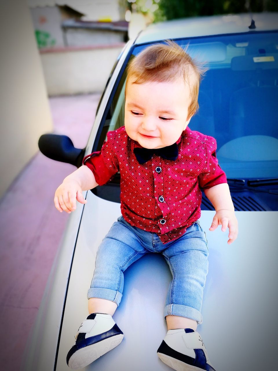 childhood, real people, cute, full length, casual clothing, one person, mode of transport, land vehicle, babyhood, sitting, transportation, car, day, happiness, lifestyles, toy car, portrait, indoors