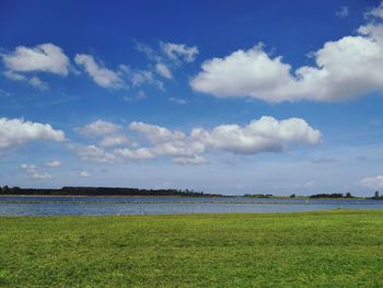 Scenic view of calm sea against cloudy sky