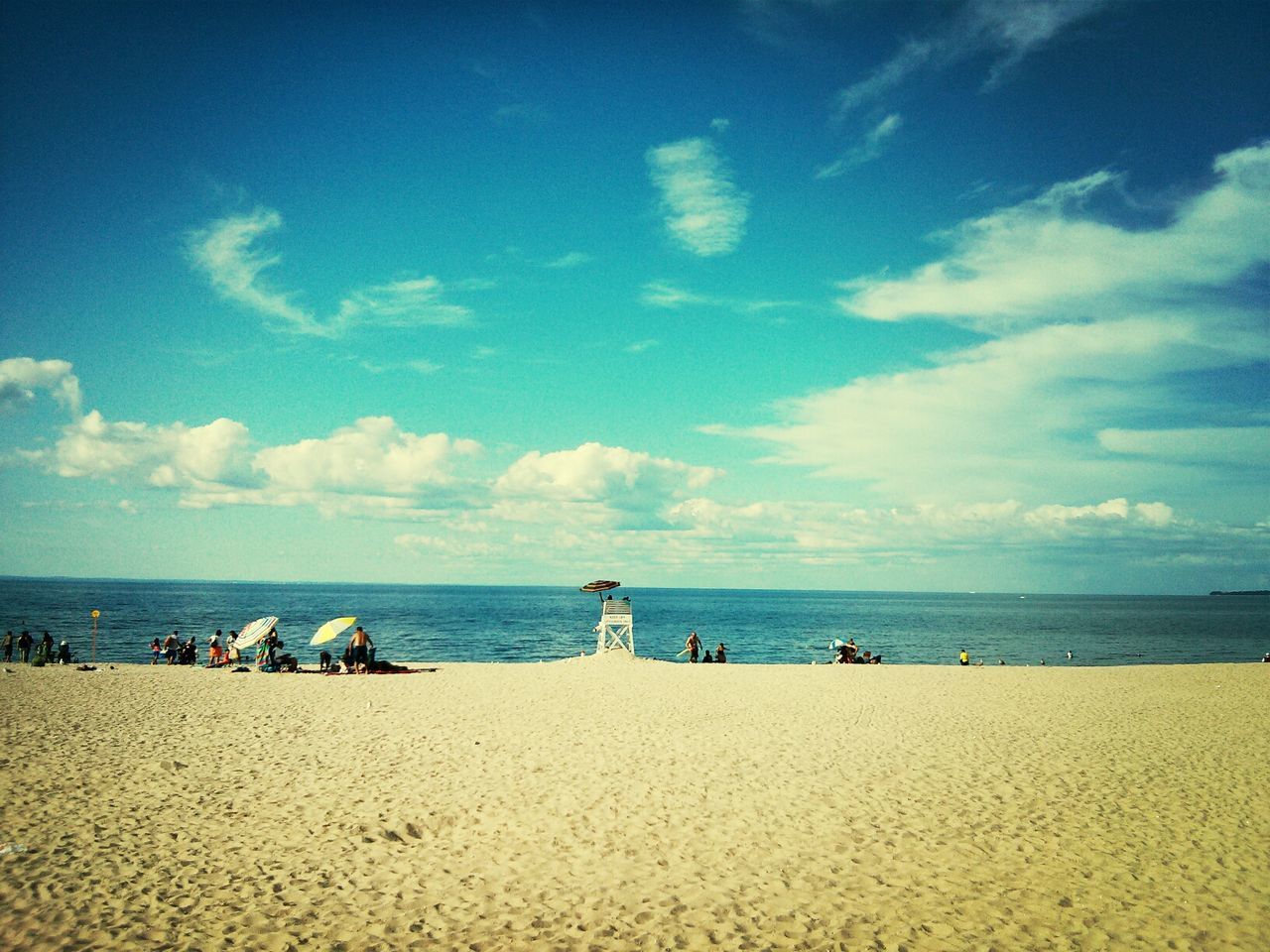 sea, beach, horizon over water, water, sky, sand, tranquil scene, tranquility, shore, scenics, beauty in nature, blue, vacations, nature, idyllic, cloud, relaxation, coastline, incidental people