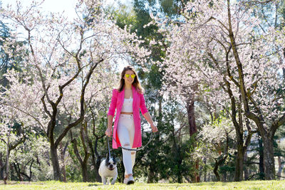 Portrait of woman standing on field