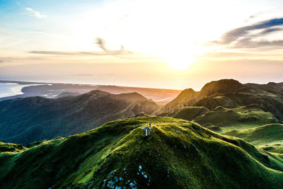 Scenic view of mountains against sky during sunset