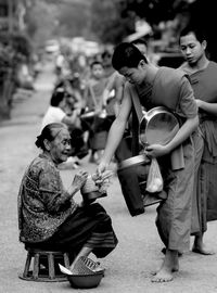 Alms giving to the monks in the morning