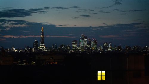 Illuminated buildings in city at night