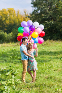 Rear view of a girl holding balloons