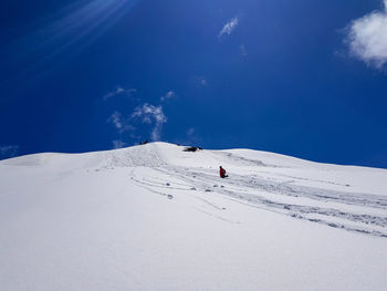 Low angle view of woman on snow covered land