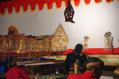 Full length of man hanging in temple