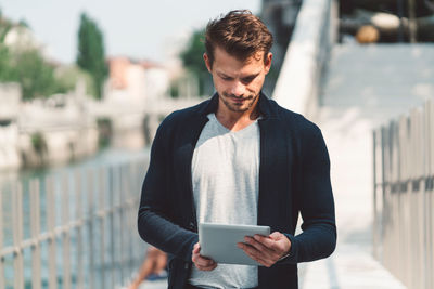 Young man using digital tablet