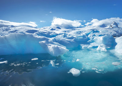 Aerial view of snowcapped mountains against sky