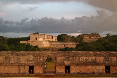 Mayan old ruins against sky at sunset