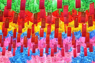 Full frame shot of multi colored umbrellas hanging at market