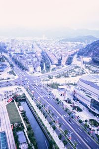 High angle view of vehicles on road in city